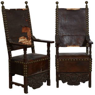 Pair of Italian Renaissance Style High Back Arm Chairs, c. 1900., H.- 61 in., W.-26 in., D.- 26 in.: Pair of Italian Renaissance Style High Back Arm Chairs, c. 1900., original canted leather back with brass ball finials. and leather seat , the flat arms with relief foliate carving,. the period