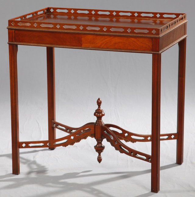 Carved Mahogany Chippendale Style Tea Table, 20th c: Carved Mahogany Chippendale Style Tea Table, 20th c., with a pierced gallery top, on reeded square legs joined by arched pierced X-form stretchers to a central turned finial, H.- 29 in., W.- 28 1/4 in
