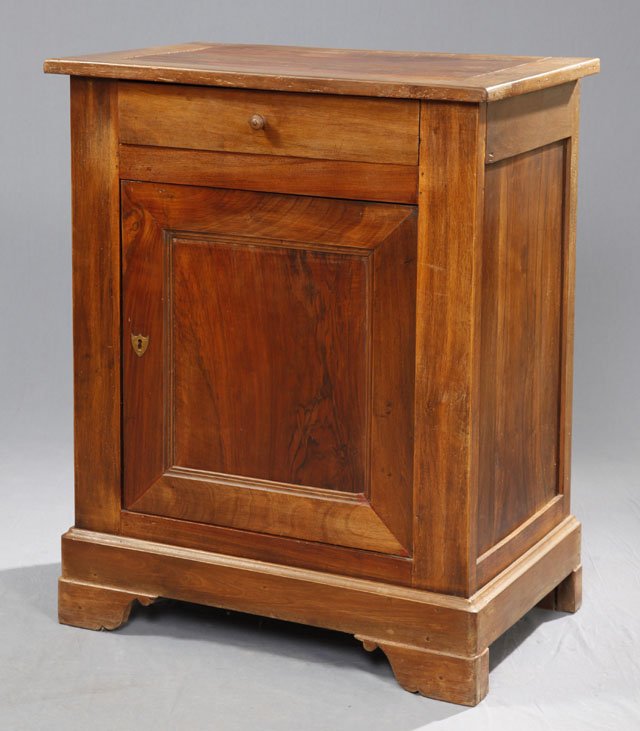 French Provincial Carved Cherry Confiturier, mid 19: French Provincial Carved Cherry Confiturier, mid 19th c., the rounded edge top over a frieze drawer and a cupboard door, on a plinth base with bracket feet, H.- 39 3/8 in., W.- 32 1/4 in., D.- 20 3/4 