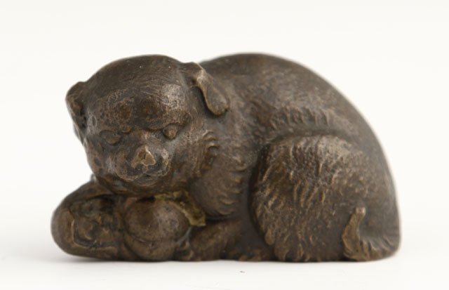 Tiffany Bronze Figure of a Dog with a Ball, 20th c: Tiffany Bronze Figure of a Dog with a Ball, 20th c., impressed "Tiffany Studios, New Your," H.- 1 1/2 in., W.- 2 1/2 in., D.- 1 1/2 in.