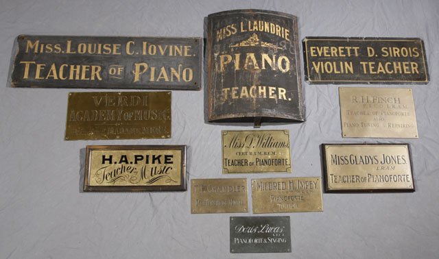 Group of Eleven Music Teacher Signs, 19th and 20th: Group of Eleven Music Teacher Signs, 19th and 20th c.: "Everett D. Sirois, Violin Teacher" tin sign; "R. H. Finch, Teacher of Pianoforte" bronze sign; "Louise C. Iovine, Teacher of Piano" wood sign; "