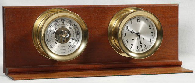 Chelsea Brass Ship's Bell Clock and Barometer, 20t: Chelsea Brass Ship's Bell Clock and Barometer, 20th c., Model L-60, Ser. # 801516, with original key and company tag, mounted on a mahogany base, H.- 3 1/2 in., Dia.- 7 3/4 in.