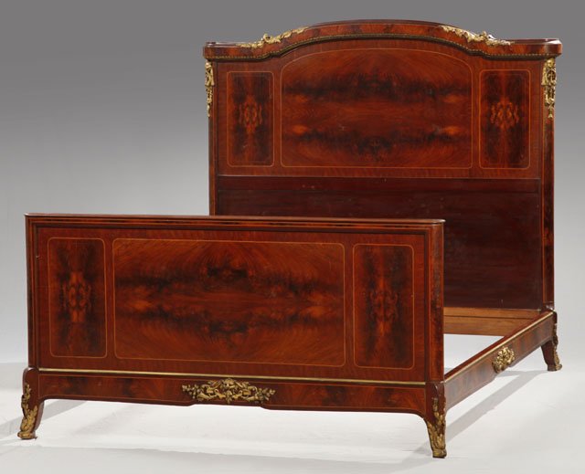 Louis XVI-Style Figured Mahogany and Gilt-Bronze M: Louis XVI-Style Figured Mahogany and Gilt-Bronze Mounted Bed, ca. 1900, the headboard with a slightly arched and molded crown with applied bronze-foliate decor and gadrooned trim, the rails featuring