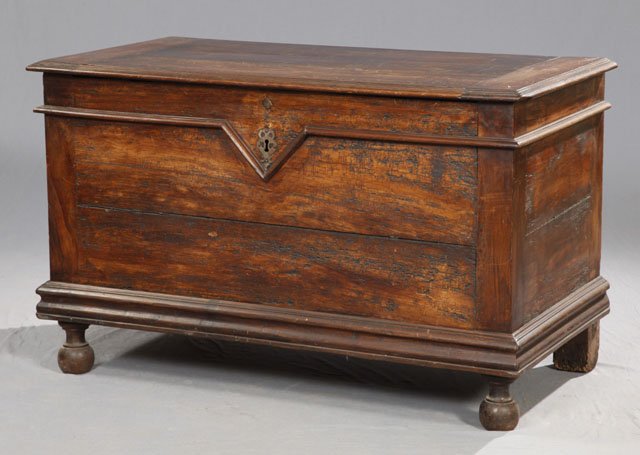 French Provincial Carved Fruitwood Coffer, c. 180: French Provincial Carved Fruitwood Coffer, c. 1800, with applied molding and a steel escutcheon, the whole on turned bun feet, H.- 31 in., W.- 51 in., D.- 26 1/2 in.