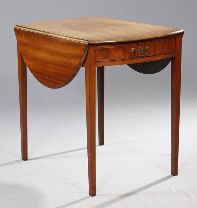 American Carved Mahogany Oval Drop Leaf Tea Table: American Carved Mahogany Oval Drop Leaf Tea Table, c. 1900, with one side drawer, on tapered square legs, H.- 28 in., W.- Closed- 21 1/2 in., Open- 40 1/4 in., D.- 32 in.
