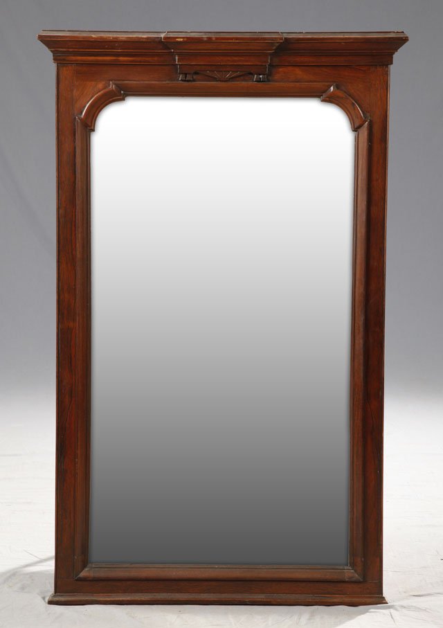 American Carved Rosewood Overmantel Mirror, c. 18: American Carved Rosewood Overmantel Mirror, c. 1870, with an ogee carved block form crown over a shaped plate, within a border of relief molding, H.- 50 in., W.- 31 3/8 in., D.- 2 7/8 in.