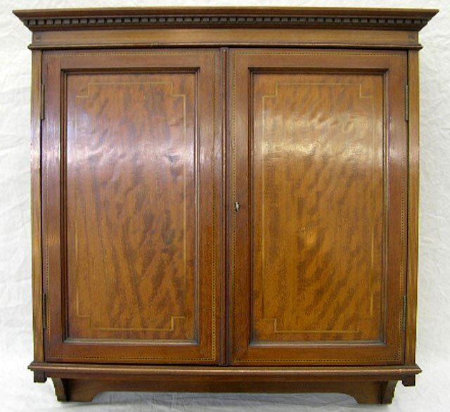 Edwardian Inlaid Mahogany Wall Cabinet, c. 1910, : Edwardian Inlaid Mahogany Wall Cabinet, c. 1910, the dentillated crown over double doors with parquetry and line inlay, with two shelves within, H.- 24 3/4 in., W.- 24 in., D.- 7 7/8 in.