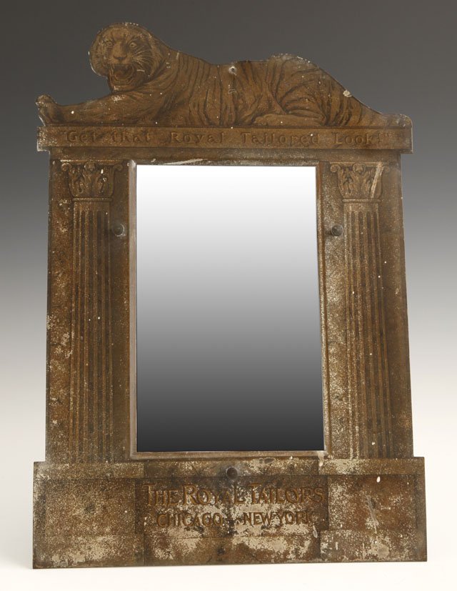 Unusual Die Cut Tin Lithographed Advertising Ease: Unusual Die Cut Tin Lithographed Advertising Easel Mirror, early 20th c., for "The Royal Tailors, Chicago-New York," the pediment with a tiger over the motto "Get That Royal Tailored Look," H.- 16 1/2