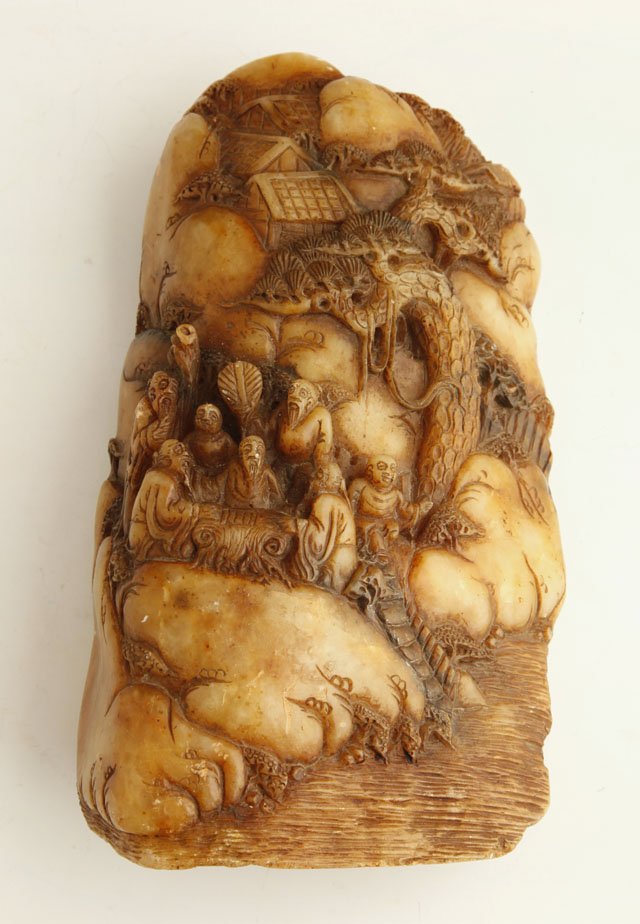 Oriental Intricately Carved Soapstone Mountain, e: Oriental Intricately Carved Soapstone Mountain, early 20th c., decorated with figures and trees, H.- 9 in., W.- 5 1/4 in., D.- 2 1/2 in.