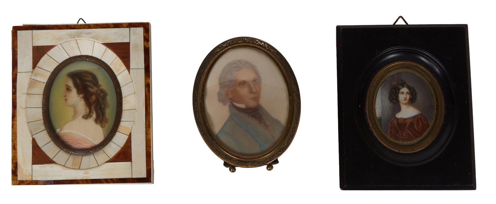 Group of Three Watercolor Portrait Miniatures, 19th c., Oval- Frame- H.- 5 3/4 in., W.- 3 3/4 in., D: Group of Three Watercolor Portrait Miniatures, 19th c., consisting of a man, in an oval easel frame; a woman in a brown dress, in a black wood frame; and a woman wearing pearls, signed "Winterhalter" 
