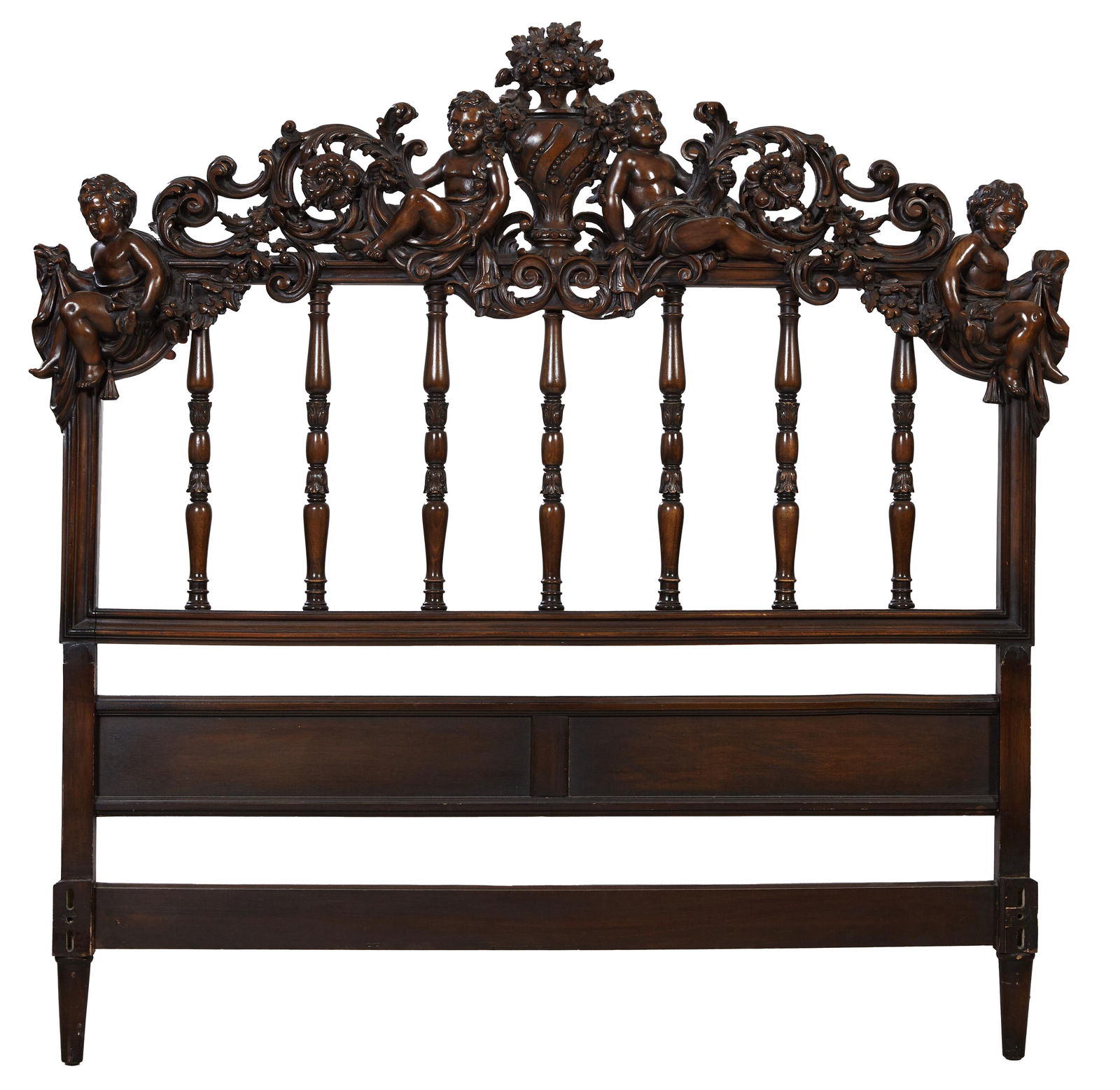 Renaissance Revival Carved Putti Headboard, 20th c., H.- 64 in., W.- 64 in.: Renaissance Revival Carved Putti Headboard, 20th c., queen size, the central relief carved floral urn flanked by floral and foliate acanthus scrolls and swags held by draped putti, on ring turned foli