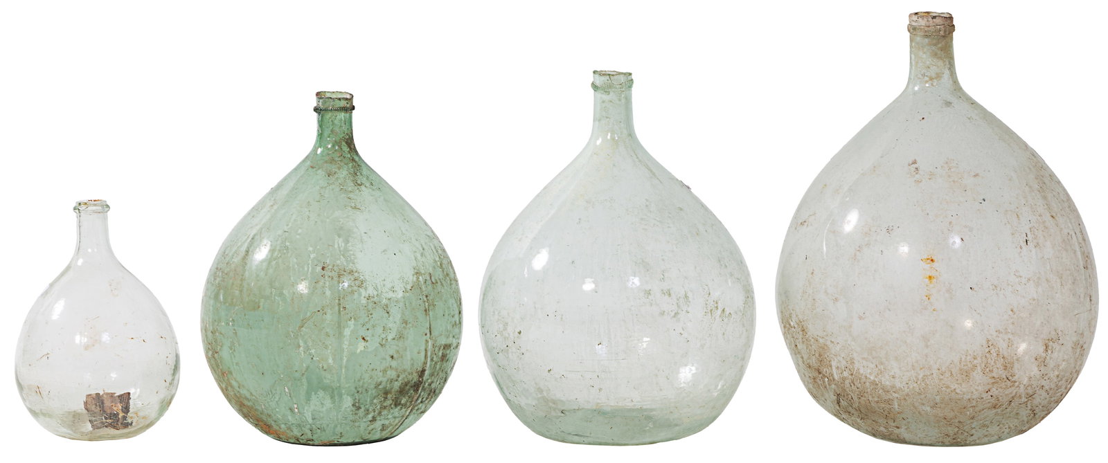 Group of Four French Provincial Mold Blown Glass Wine Carboys, 19th c., Largest- H.- 22 in., Dia.-: Group of Four French Provincial Mold Blown Glass Wine Carboys, 19th c., three of pale green, one small clear glass example, Largest- H.- 22 in., Dia.- 17 in. (4 Pcs.)