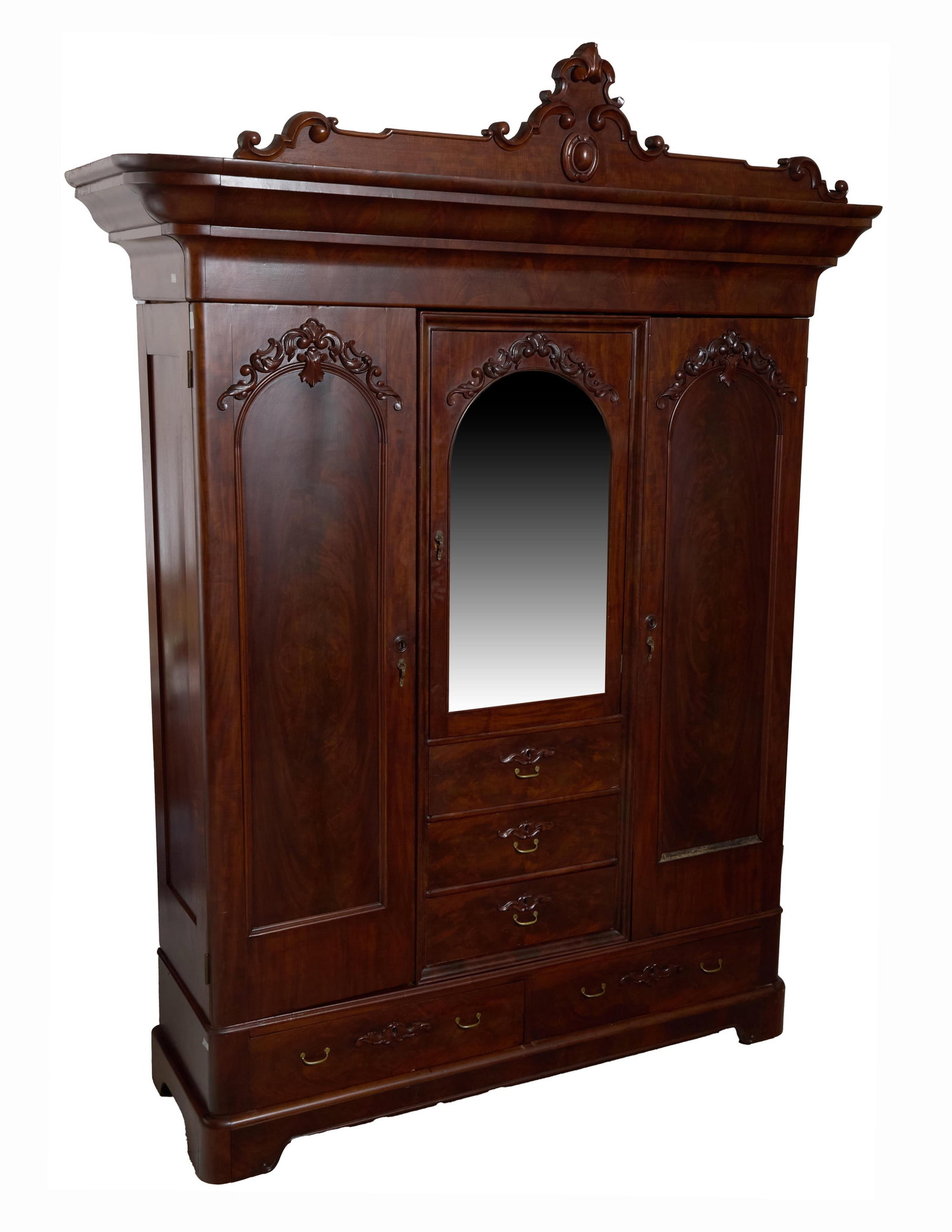 American Rococo Mahogany Armoire, mid 19th c., possibly retailed by Prudent Mallard, H.- 101 1/2: American Rococo Mahogany Armoire, mid 19th c., possibly retailed by Prudent Mallard, the scrolled pediment crest with cabochon, over stepped cornice, the arched central aged mirrored door having three