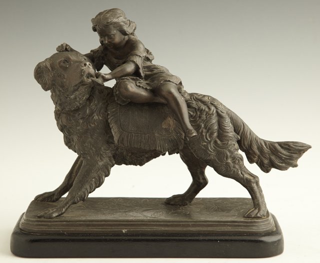Patinated Spelter Figure, 19th c., of a child ridin: Patinated Spelter Figure, 19th c., of a child riding on a large dog, trying to pull her shoe from his mouth, on a floral incised base, mounted on a stepped ebonized wood base, H.- 8 3/4 in., W.- 9 5/8
