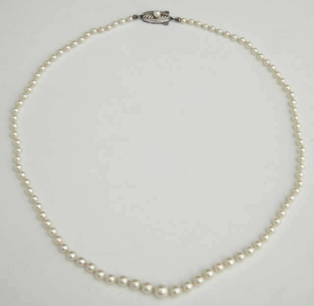 Strand of Mikimoto Graduated Pearls, the sterling : Strand of Mikimoto Graduated Pearls, the sterling clasp also mounted with a small pearl, L.- 20 in.