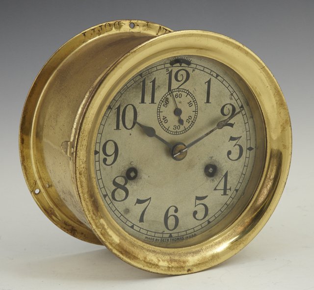 Brass Ship's Clock, early 20th c., by Seth Thomas,: Brass Ship's Clock, early 20th c., by Seth Thomas, the rim stamped "John P. Duffy," running, H.- 4 in., Dia.- 7 in.