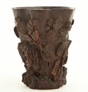 Chinese Carved Libation Cup, 19th: Chinese Carved Libation Cup, 19th c., of tapered form, with relief floral decoration, H.- 3 5/8 in., W.- 2 7/8 in., D.- 2 3/4 in.