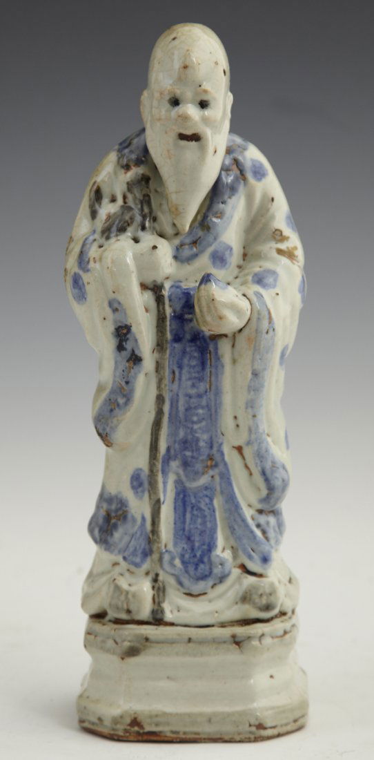 Chinese Polychromed Glazed Earthenware Figure, ear: Chinese Polychromed Glazed Earthenware Figure, early 20th c., of a sage, on a stepped integral octagonal base, H.- 10 1/8 in., W.- 3 3/8 in., D.- 3 in.