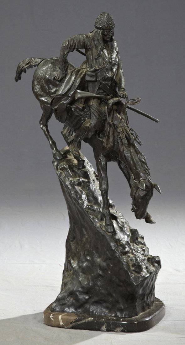 Frederic Remington (1861-1909), "Mountain Man," 20: Frederic Remington (1861-1909), "Mountain Man," 20th c., patinated bronze, signed right front "Copyright by Frederic Remington," stamped 122/500, presented on a highly figured black marble base, H.- 2