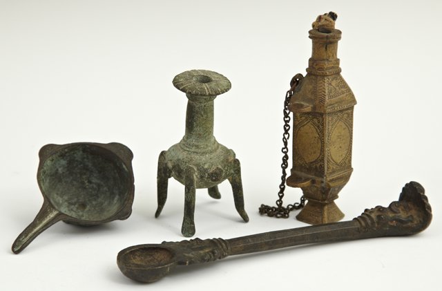 Group of Four Bronze Objests, 19th c., and earlier: Group of Four Bronze Objects, 19th c., and earlier, Saudi Arabia, consisting of a rectangular snuff bottle; a small pouring cup; a small spoon with a figural terminal; and a three legged jar. (4 Pcs.)