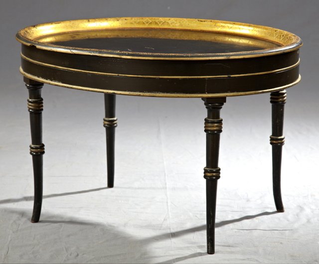 English Oval Black Lacquered Papier Mache Tray, c.: English Oval Black Lacquered Papier Mache Tray, c. 1860, with a wide gilt rim with tracery decoration, on a later ebonized stand, on tapered splayed legs with gilt highlights, H.- 18 in., W.- 27 1/2 i
