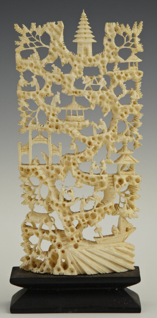 Japanese Pierce Carved Ivory Mountain, early 20th: Japanese Pierce Carved Ivory Mountain, early 20th c., with landscape decoration, on a carved ebonized wood base, H.-6 3/4 in., W.- 3 in., D.- 1 in.