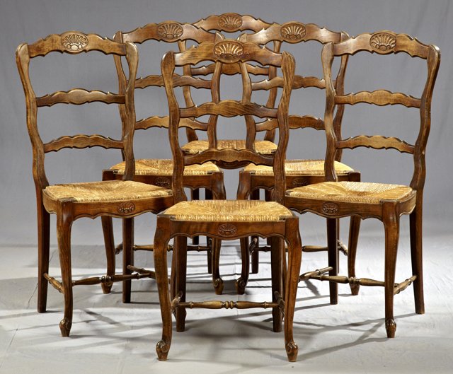 Set of Six Carved Birch Rush Seat Ladderback Dini: Set of Six Carved Birch Rush Seat Ladderback Dining Chairs, early 20th c., with shaped skirts, on cabriole legs joined by turned stretchers, H.- 38 1/2 in.