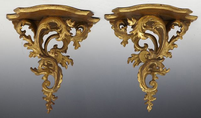Pair of Florentine Gilt and Gesso Wall Brackets,: Pair of Florentine Gilt and Gesso Wall Brackets, early 20th c., the shaped bowed shelves over pierced scrolling leaf form supports, H.- 11 1/4 in., W.- 10 1/2 in., D.- 5 3/4 in.
