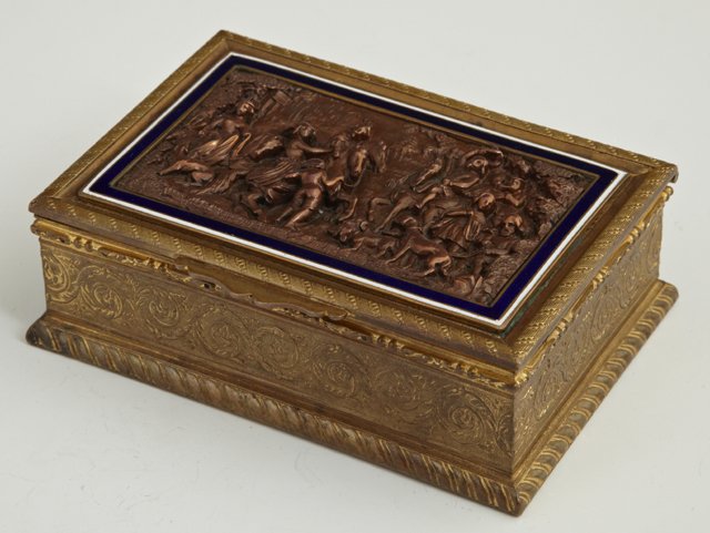 French Brass and Enamel Dresser Box, 19th c., wit: French Brass and Enamel Dresser Box, 19th c., with a central relief copper panel of a hunting scene, the sides with relief scrolled tendril decoration, H.- 1 5/8 in., W.- 5 in., D.- 3 3/8 in.