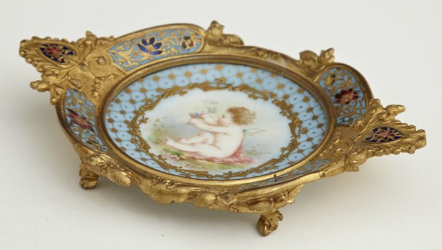Fine French Champleve on Bronze and Porcelain Pin: Fine French Champleve on Bronze and Porcelain Pin Tray, 19th c., the center with a hand painted porcelain plaque of a putto in a landscape, H.- 7/8 in., W.- 5 1/4 in., D.- 3 1/2 in.