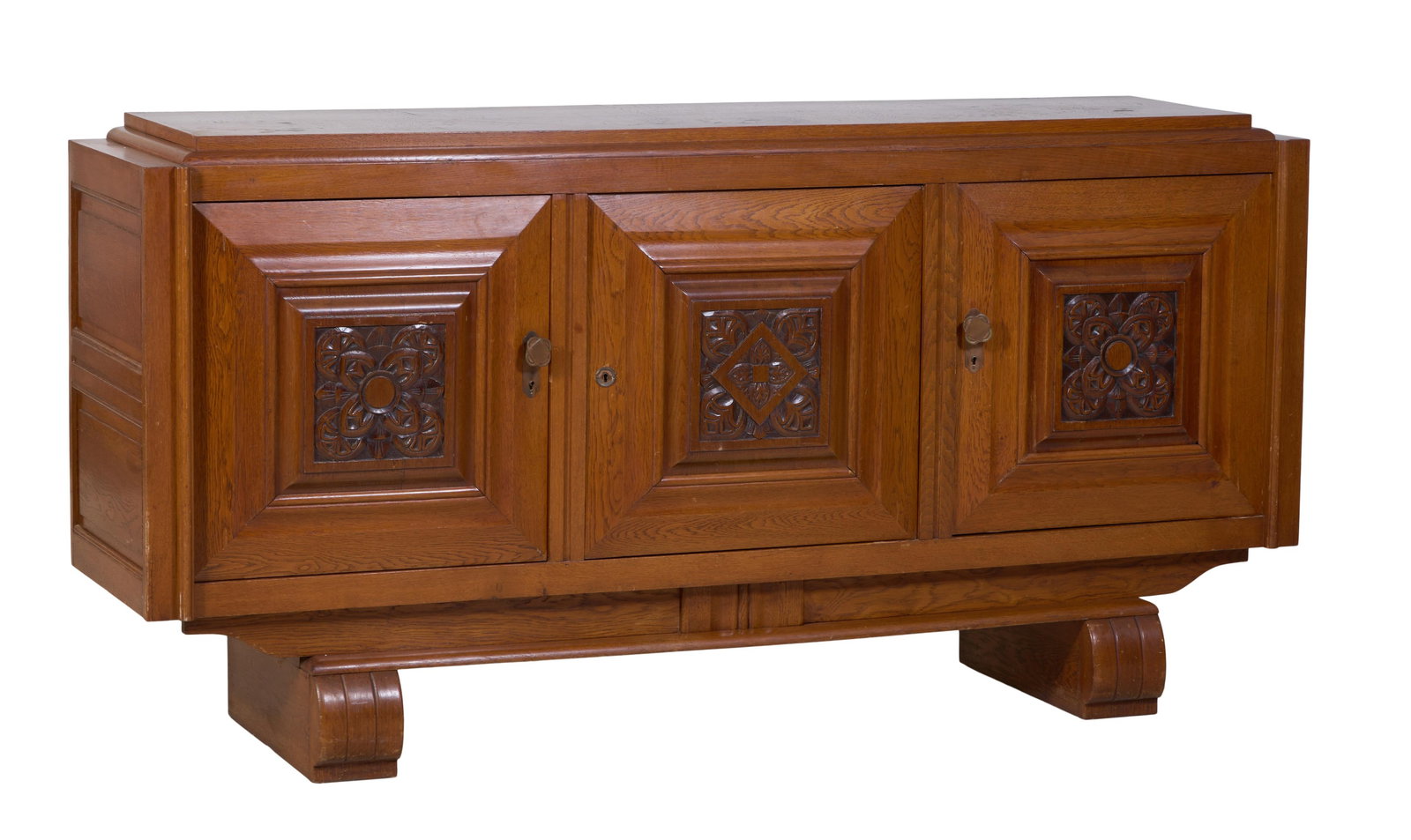 French Art Deco Oak Sideboard, early 20th c., H.- 39 1/2 in., W.- 79 in., D.- 19 3/4 in.: French Art Deco Oak Sideboard, early 20th c., the restrained stepped top over three doors with geometric carved central panels, with stepped moulded surround, on incised shaped rounded runner feet, ma