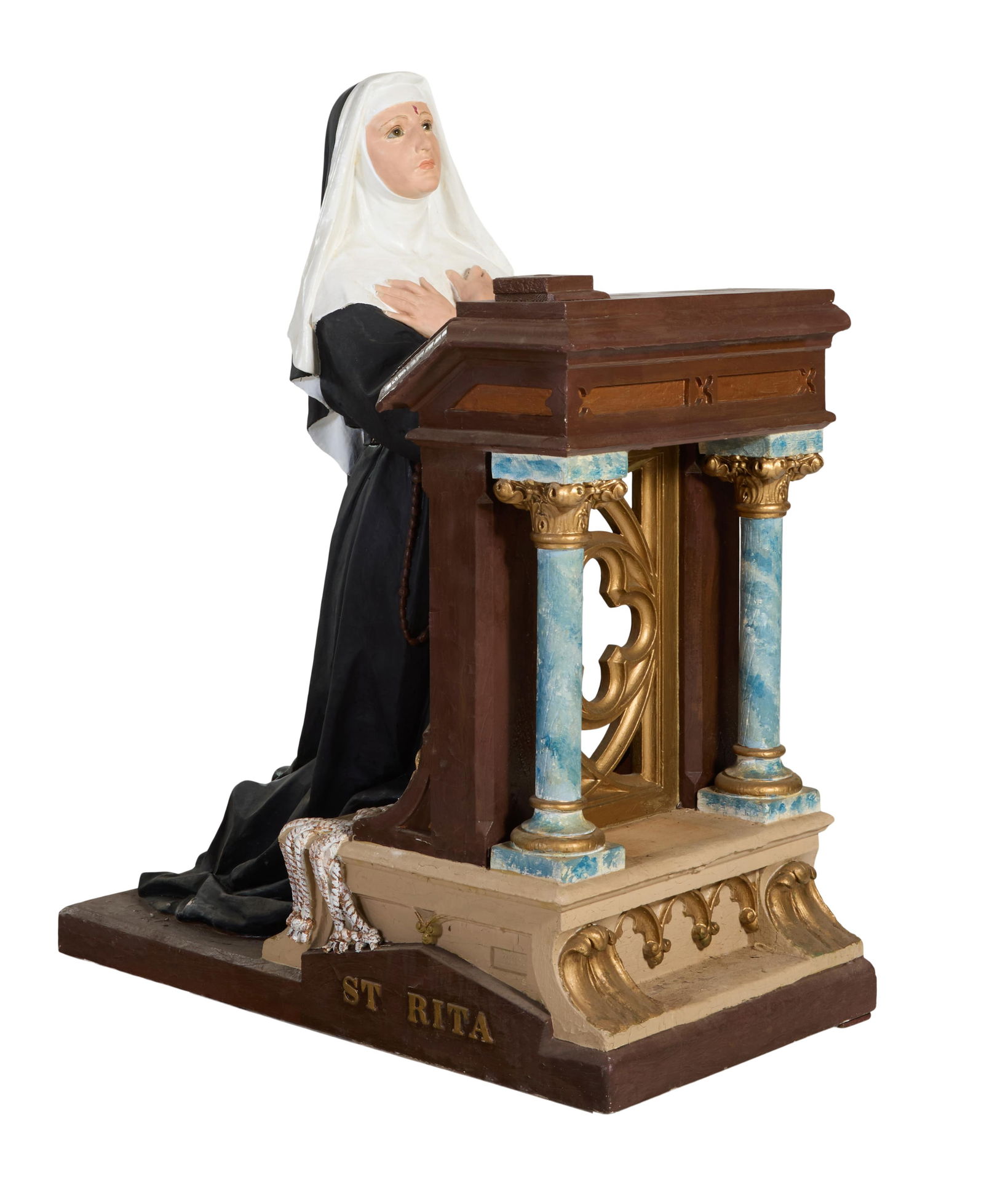 Polychromed Plaster Religious Figure, 20th c., H.- 55 1/2 in., W.- 24 in., D.- 45 in.: Polychromed Plaster Religious Figure, 20th c., of St. Rita praying at a prie dieu, H.- 55 1/2 in., W.- 24 in., D.- 45 in.