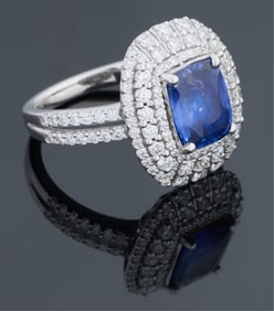 Lady's Platinum Sapphire and Diamond Dinner Ring, by Ema Hyman, Total Diamond Wt.- 0.98 carats,