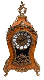 French Ormolu Mounted Inlaid Beech Mantel Clock, 20th c., H.- 19 1/4 in., W.- 9 1/4 in., D.- 4 1/2: French Ormolu Mounted Inlaid Beech Mantel Clock, 20th c., with bronze mounts over a time and strike bronze face movement with porcelain chapter marks, H.- 19 1/4 in., W.- 9 1/4 in., D.- 4 1/2 in.