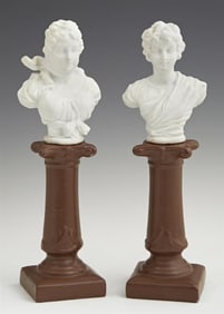 Pair of Continental Bisque Busts, early 20th c., Each- H.- 9 in., W.- 3 in., D.- 2 5/16 in. (2 Pcs.)