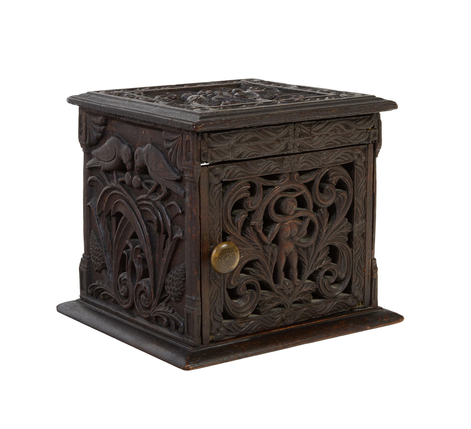 Diminutive Pierce Carved Mahogany Cabinet, 19th c., H.- 7 3/4 in., W.- 8 3/4 in., D.- 8 in.: Diminutive Pierce Carved Mahogany Cabinet, 19th c., with bird, botanical and figural carvings, on a sloping integral base, with one door, H.- 7 3/4 in., W.- 8 3/4 in., D.- 8 in.