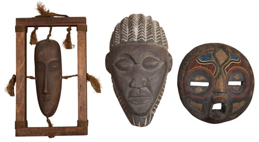 Group of Three African Carved Wooden Masks, 20th c., Circular- H.- 3 1/2 in., Dia.- 10 1/2 in.