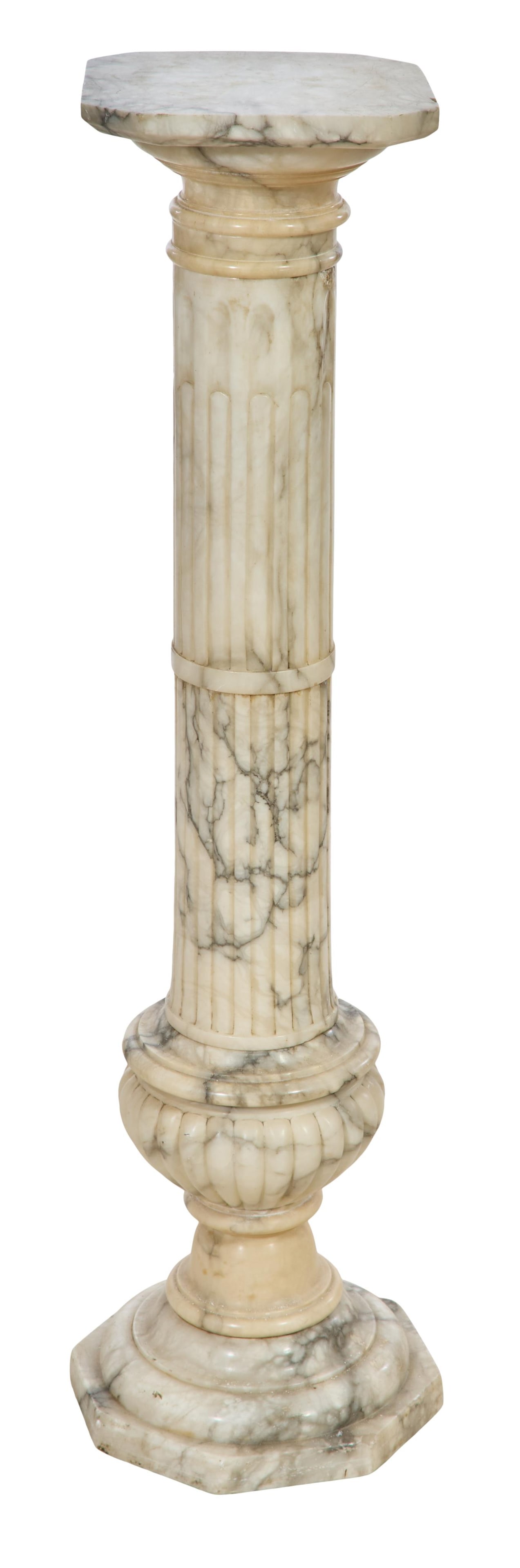 French Carved Marble Pedestal, 20th c., H.- 41 in., W.- 12 in., D.- 12 in.: French Carved Marble Pedestal, 20th c., the octagonal top on a reeded support, with a shaped reeded soclee on an octagonal plinth, H.- 41 in., W.- 12 in., D.- 12 in.