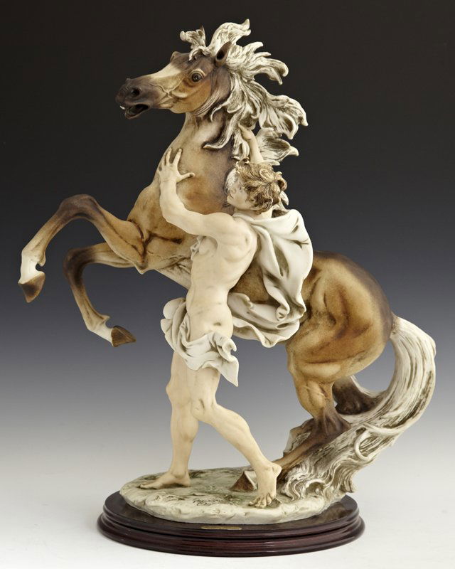 Giuseppi Armani , "Freedom," 1992, porcelain figural gr: Giuseppi Armani , "Freedom," 1992, porcelain figural group, 1021/3000, marked with the Capodimonte mark, on an integral stepped mahogany base, H.- 18 1/4 in., W.- 15 in., D.- 9 3/4 in.