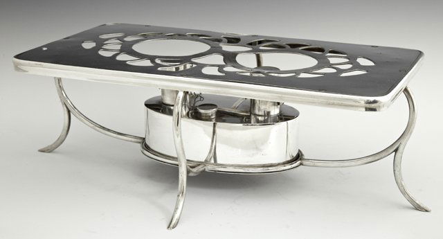 A Silver Plated Rectangular Table Warming Stand, early : A Silver Plated Rectangular Table Warming Stand, early 20th c., with a pierced top and double burners, H.- 5 1/2 in., W.- 19 in., D.- 11 1/2 in.