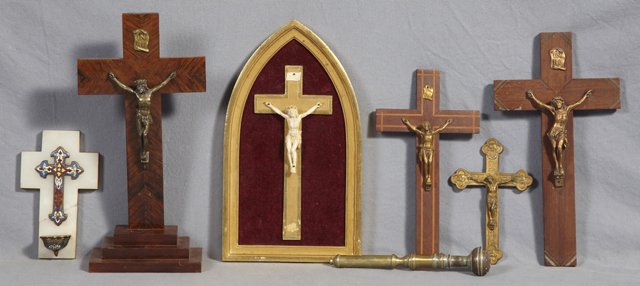 Group of Seven Religious Items, 20th c., consisting of : Group of Seven Religious Items, 20th c., consisting of a tabletop crucifix, four crucifixes, an onyx and champleve holy water font, and a brass plated holy water sprinkler. (7 Pcs.)