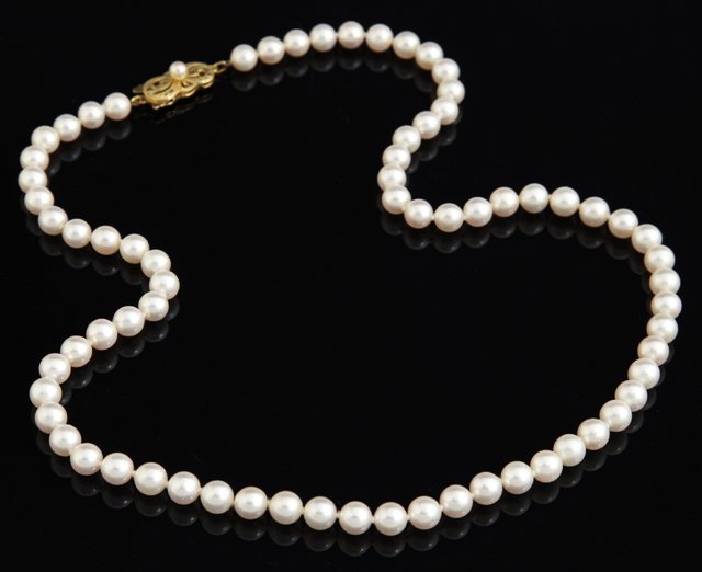 Strand of Mikimoto 5mm Cultured Pearls, with an 18K yel: Strand of Mikimoto 5mm Cultured Pearls, with an 18K yellow gold clasp with a central 3mm cultured pearl, W.- 18 in.