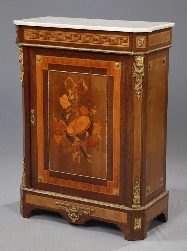 Inlaid Mahogany Ormolu Mounted Marble Top Parlor Cabine: Inlaid Mahogany Ormolu Mounted Marble Top Parlor Cabinet, 19th c., the white block edge marble on a canted corner base with a geometric inlaid frieze over a banded door with a central marquetry inlaid