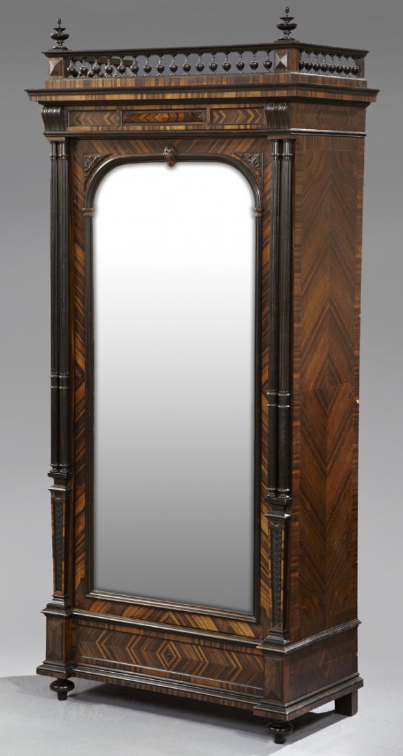 Louis XVI Style Kingwood Single Door Armoire, c. 1890, : Louis XVI Style Kingwood Single Door Armoire, c. 1890, with a spindled crest over an ogee crown above a relief decorated panel over an arched beveled mirror door flanked by applied columns over lappet