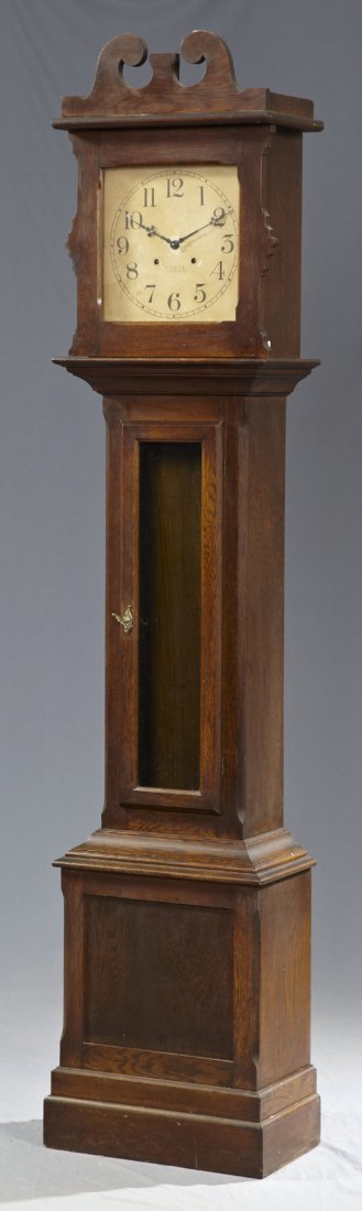 Ithaca Carved Oak Tall Case Clock, early 20th c., with : Ithaca Carved Oak Tall Case Clock, early 20th c., with a broken arch pediment over a paper dial, now lacking weights and pendulum, H.- 85 1/4 in., W.- 19 in., D.- 10 3/4 in.