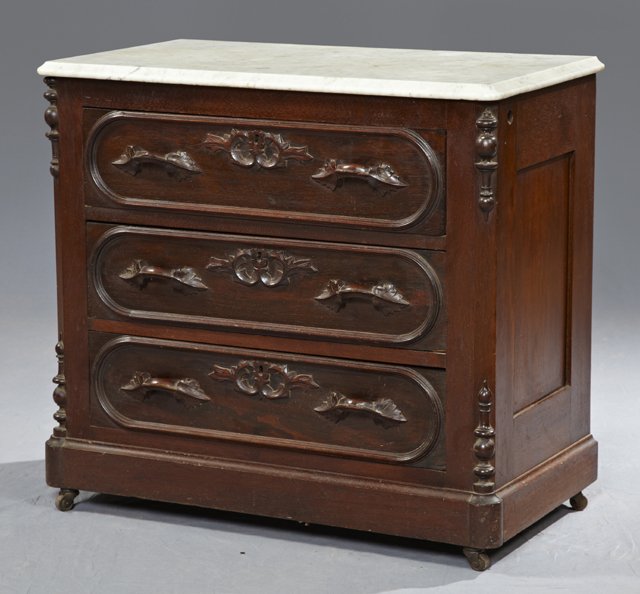 American Carved Walnut Marble Top Washstand Base, c. 18: American Carved Walnut Marble Top Washstand Base, c. 1880, the ogee edge white marble on a canted corner base with three drawers with leaf carved pulls, on a plinth base, H.- 28 in., W.- 30 1/4 in., D