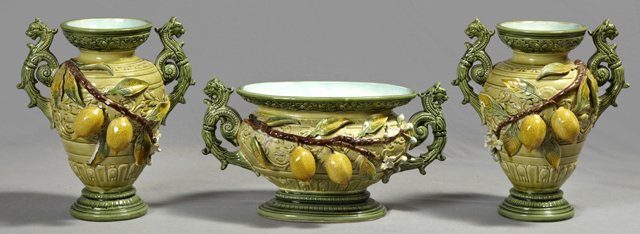 Elaborate Three Piece Majolica Mantel Garniture, 19th c: Elaborate Three Piece Majolica Mantel Garniture, 19th c., consisting of an oval bowl and two baluster vases, all with relief lemon decorations and lions' head handles, as found, Bowl- H.- 8 3/4 in., W