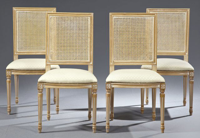 Set of Four Louis XVI Style Carved Cherry Dining Chairs: Set of Four Louis XVI Style Carved Cherry Dining Chairs, 20th c., with caned backs over upholstered seats with brass tack upholstery, on reeded tapered legs on toupie feet, now in a white highlighted