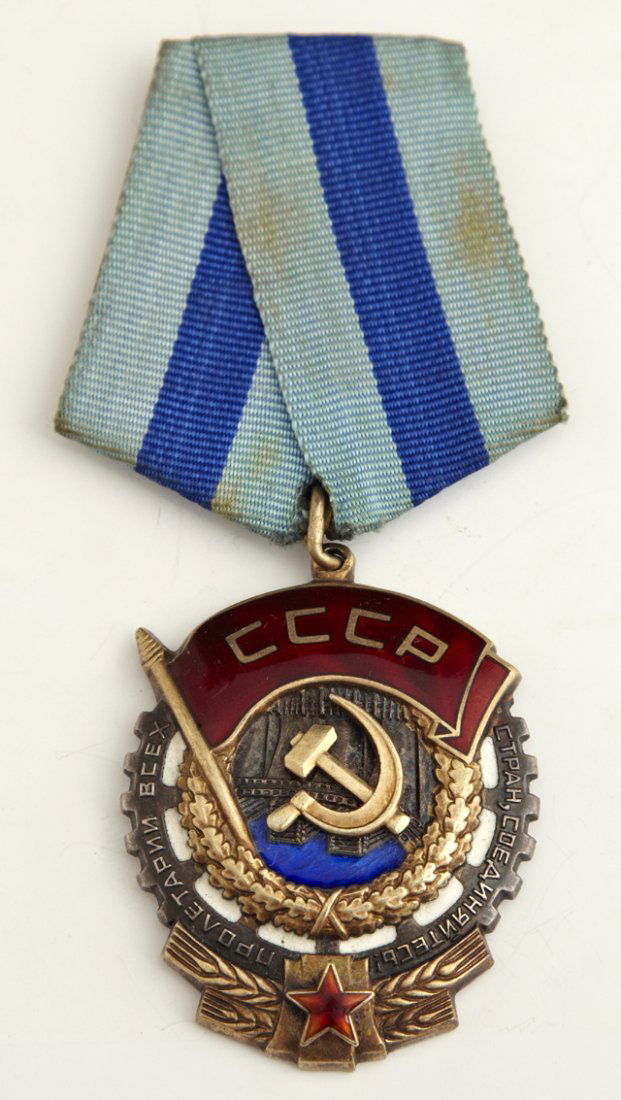Soviet Silver and Gold Medal, "Order of The Red Banner : Soviet Silver and Gold Medal, "Order of The Red Banner of Labour," #454897, suspended from a blue ribbon pin, H.- 1 3/4 in., W.- 1 1/2 in.