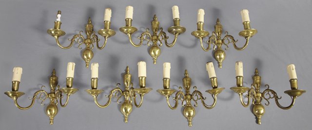 Set of Seven Brass Two Light Wall Sconces, 20th c., wit: Set of Seven Brass Two Light Wall Sconces, 20th c., with urn and ball form back plates, H.- 9 1/2 in., W.- 6 1/4 in., D.- 10 1/2 in.